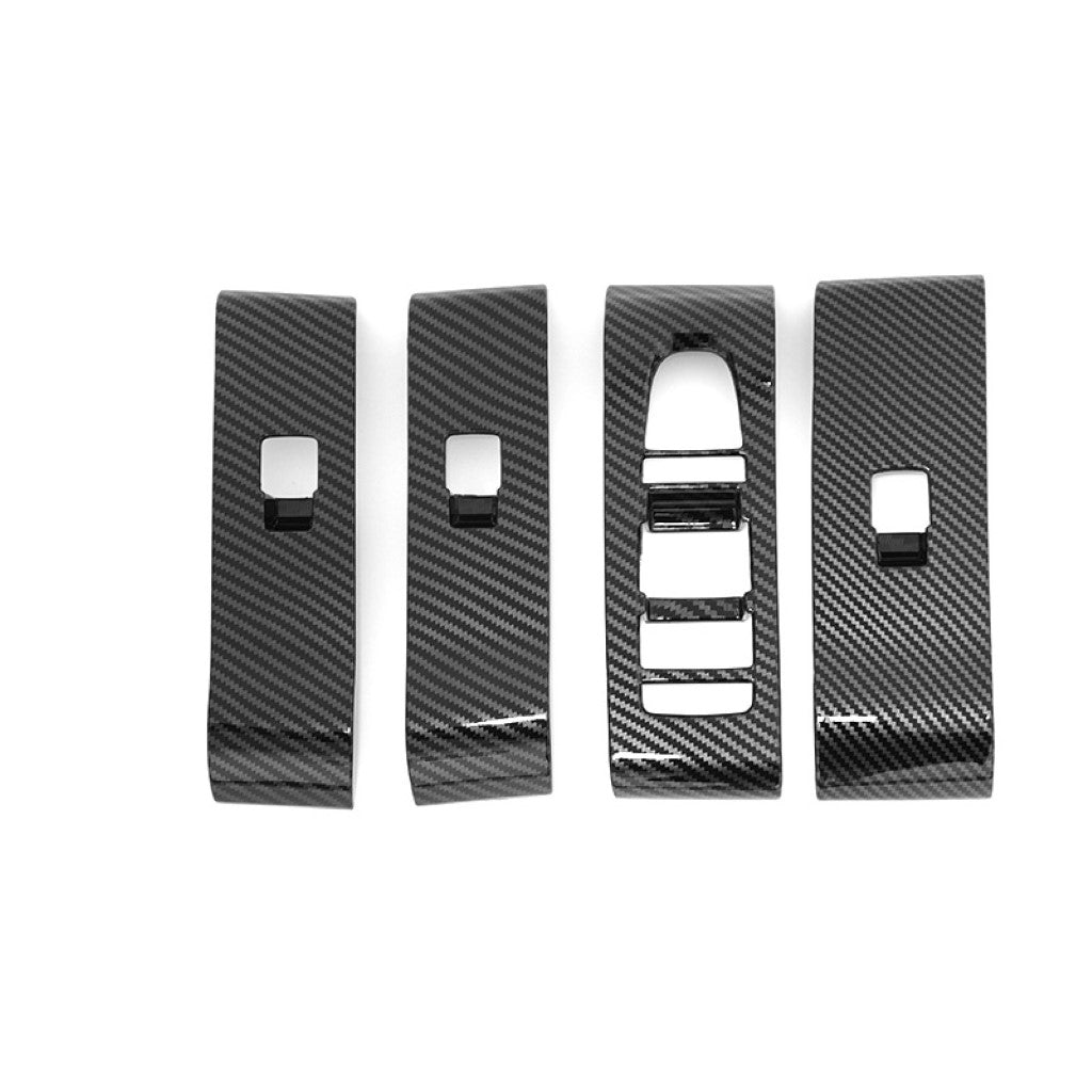 BYD ATTO 3 Armrest Window Riser Cover set in ABS imitation carbon fibre, designed for enhanced protection and style.