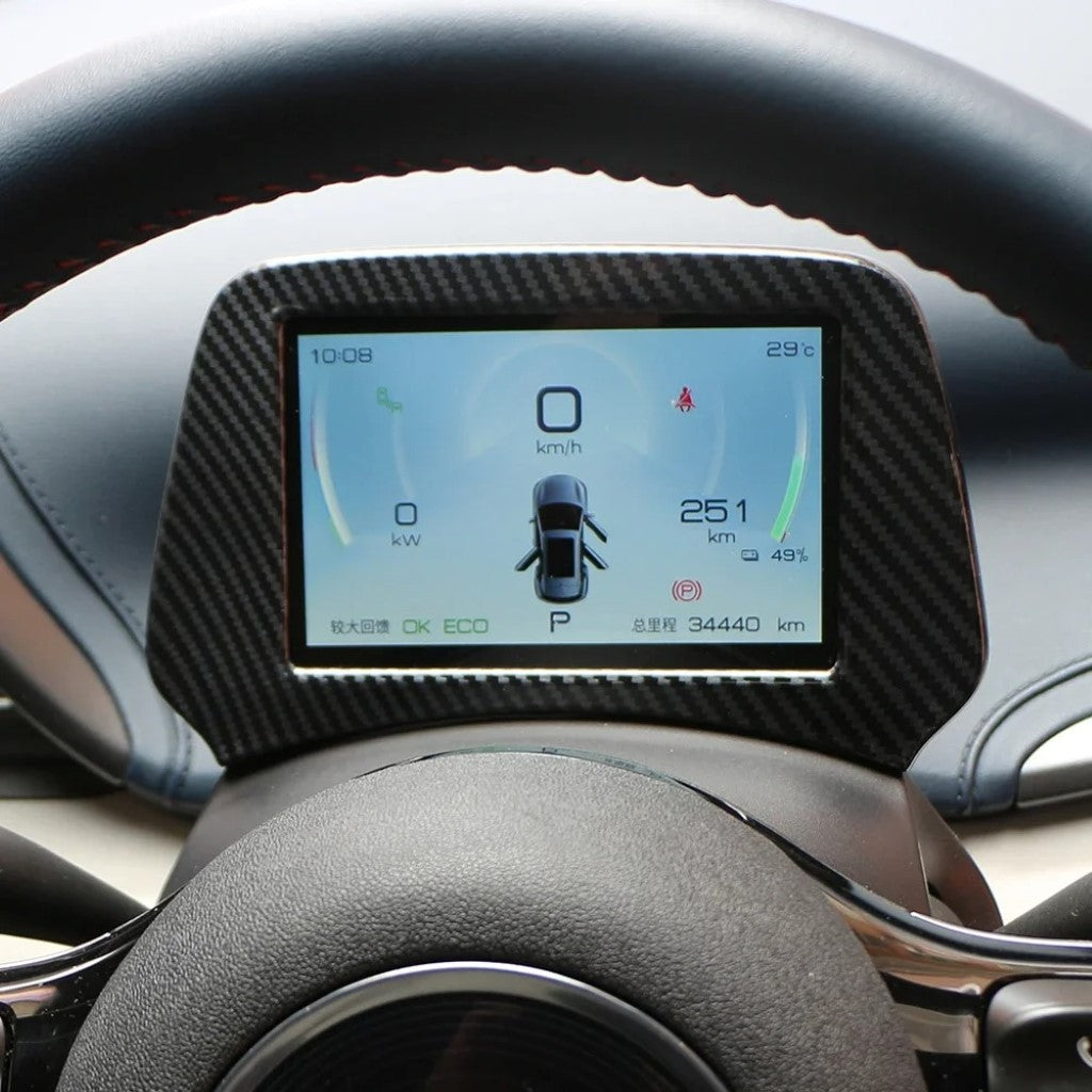 BYD ATTO 3 Dashboard Panel Trim Cover in imitation carbon fibre protecting and enhancing the digital display panel.
