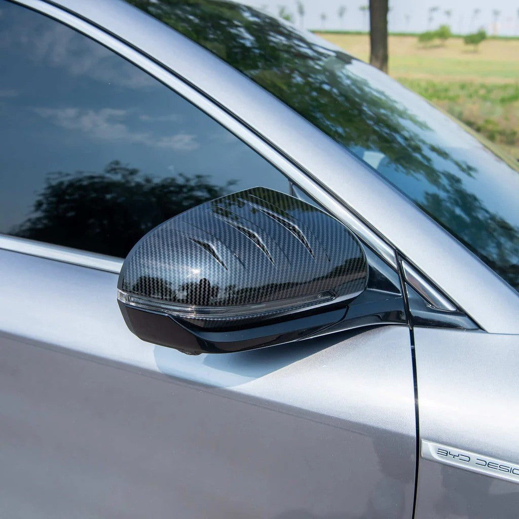 BYD ATTO 3 Side Mirror Covers in carbon fibre finish on electric vehicle side mirror with sleek, durable design.