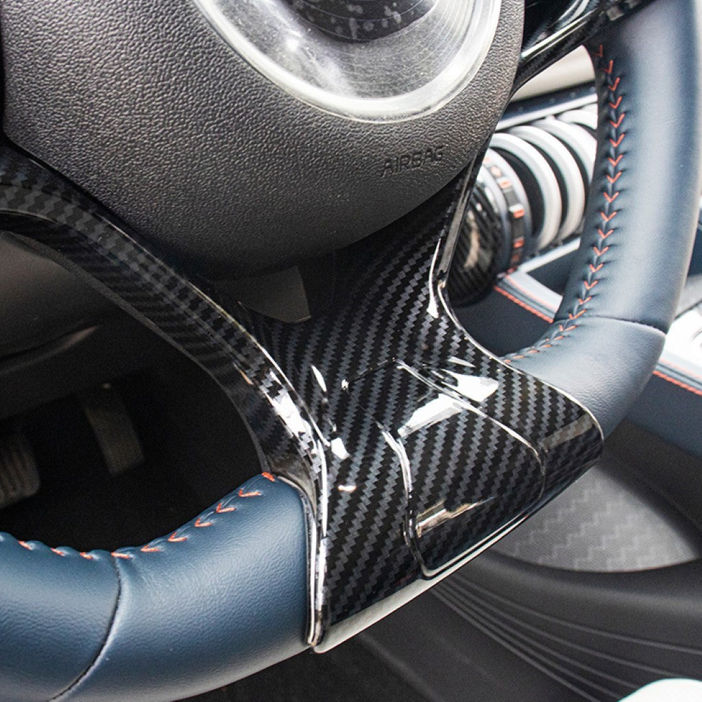 BYD ATTO 3 Steering Wheel Trim Cover in glossy ABS imitation carbon fibre enhancing grip and interior style.