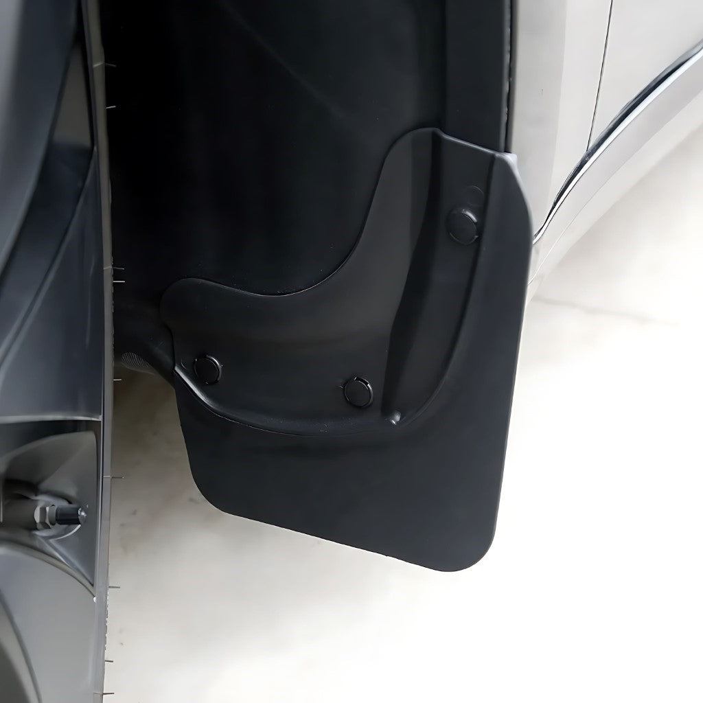Mud Flaps For Tesla Model 3 Highland shown installed, custom-fit black mud guard protecting rear wheel arch.