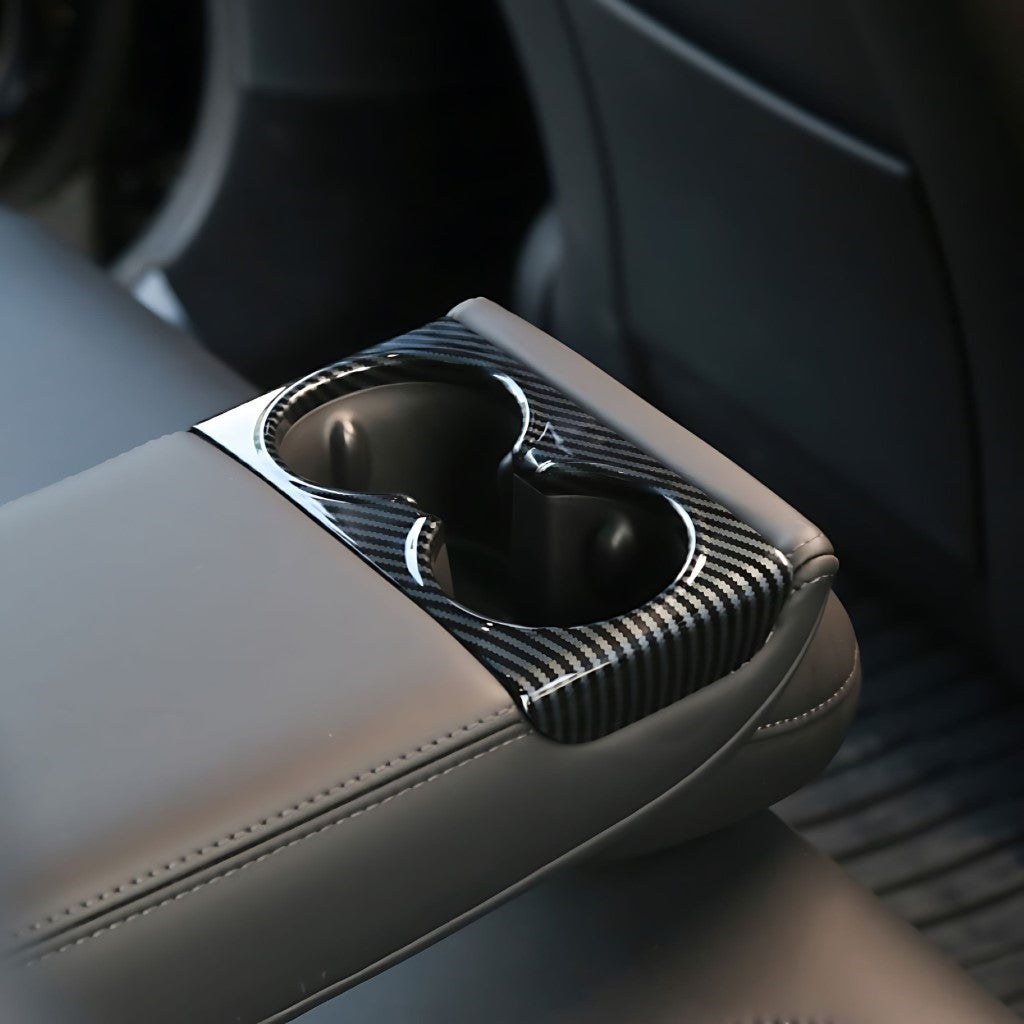 Rear Seat Cup Holder Cover For Tesla Model 3 (Highland) in glossy carbon fibre protecting rear cup holders.