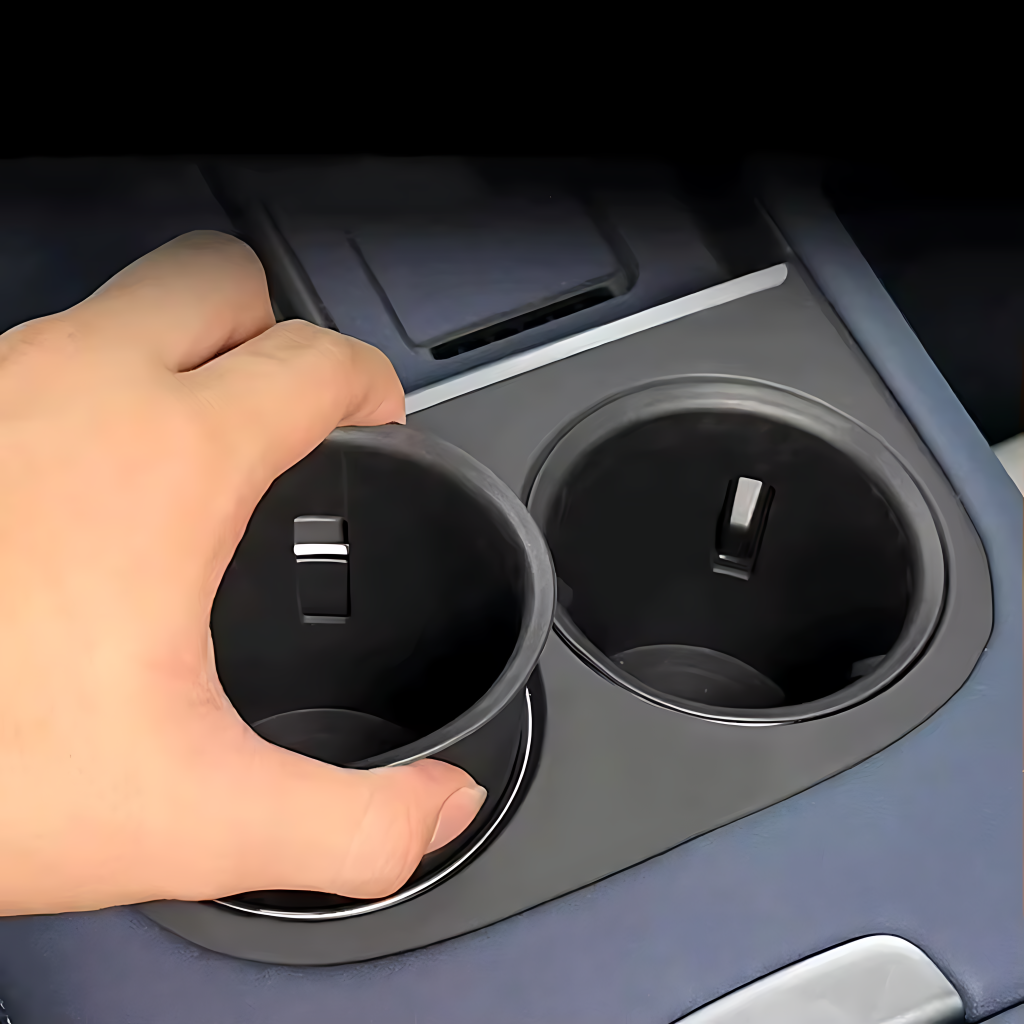 XPENG G6 Centre Console Cup Holder Trim Cover showing hand removing cup insert from electric vehicle interior trim.