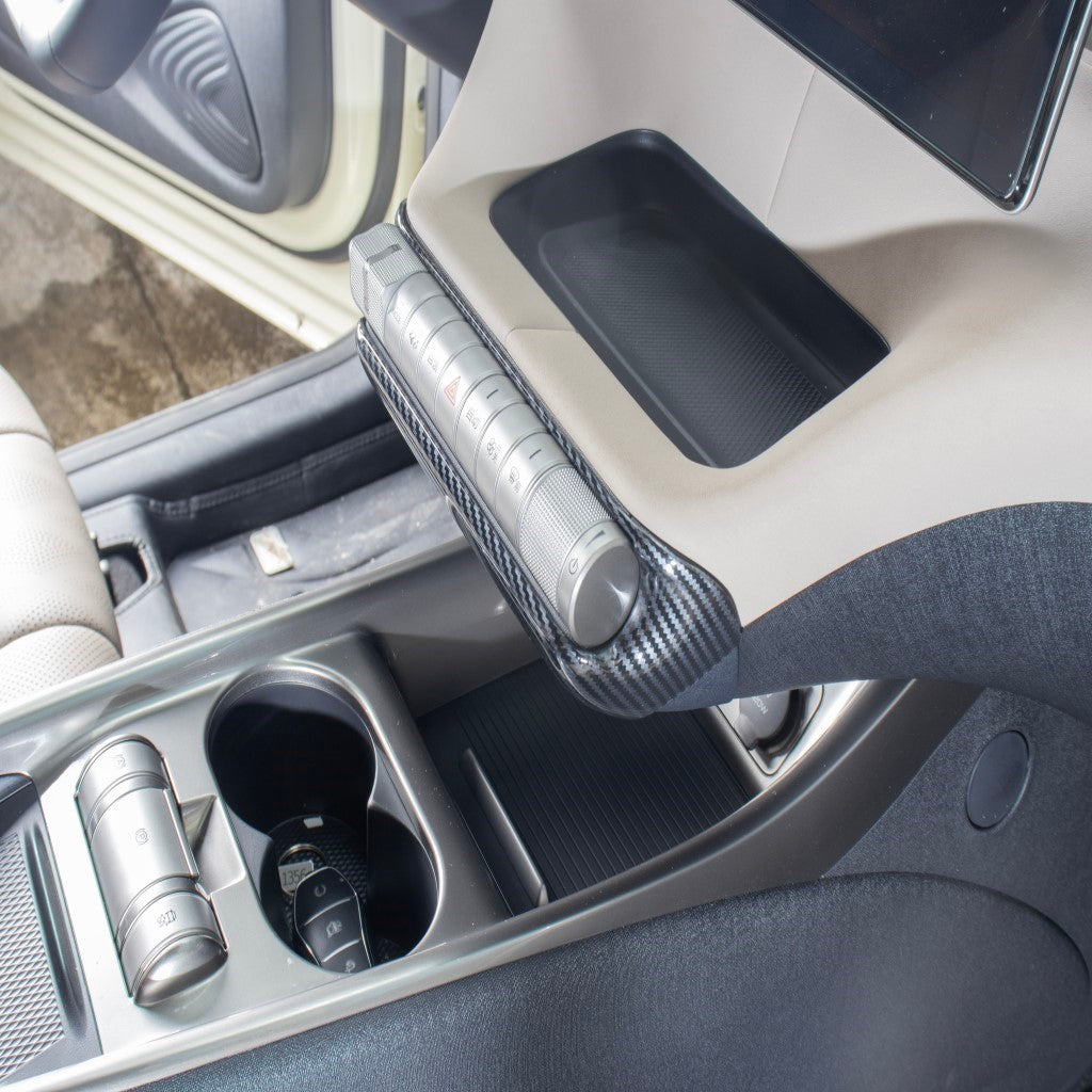 BYD Dolphin AC Control Panel Switch Cover installed, showing sleek carbon fibre design and centre console integration.