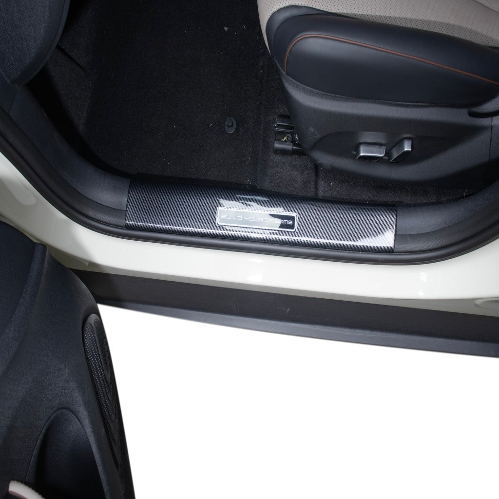 BYD Dolphin Inner Door Sill Guards in carbon fibre style protecting vehicle door area with sleek finish.