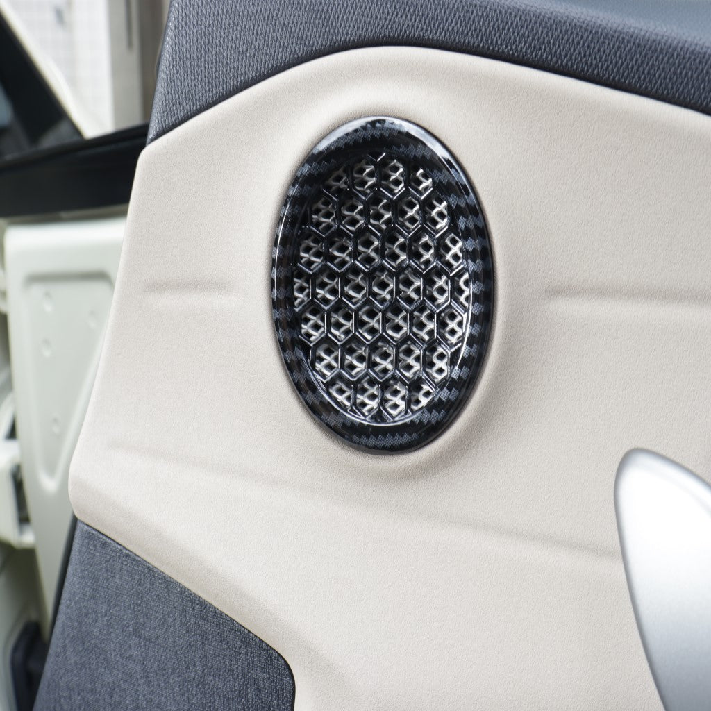BYD Dolphin Speaker Covers in imitation carbon design installed on vehicle door, protecting and enhancing speaker appearance.