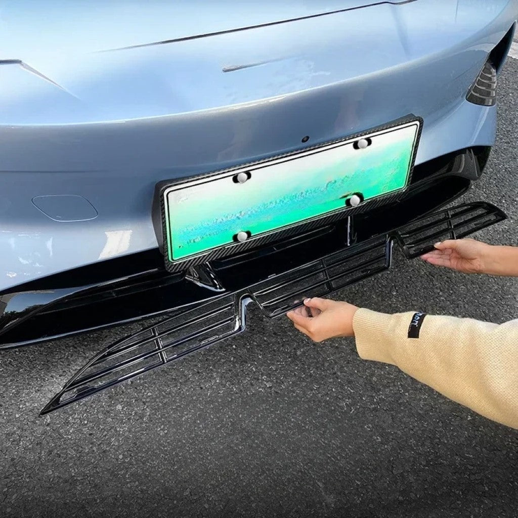 BYD Seal Front Mesh Grille Cover being installed on the front bumper of a light blue BYD Seal electric vehicle.