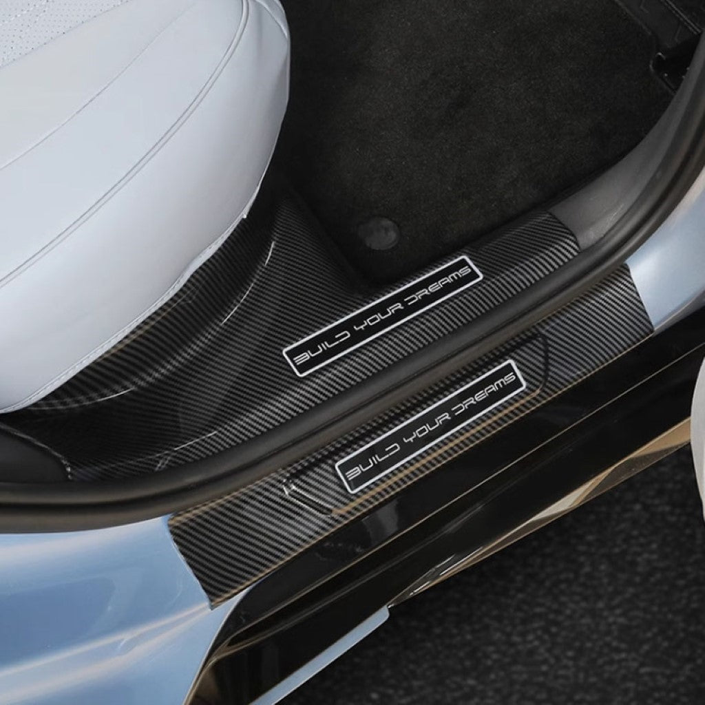 BYD Seal Inner Door Sill Guards in carbon fibre finish installed on the driver’s side door sill of an electric vehicle.