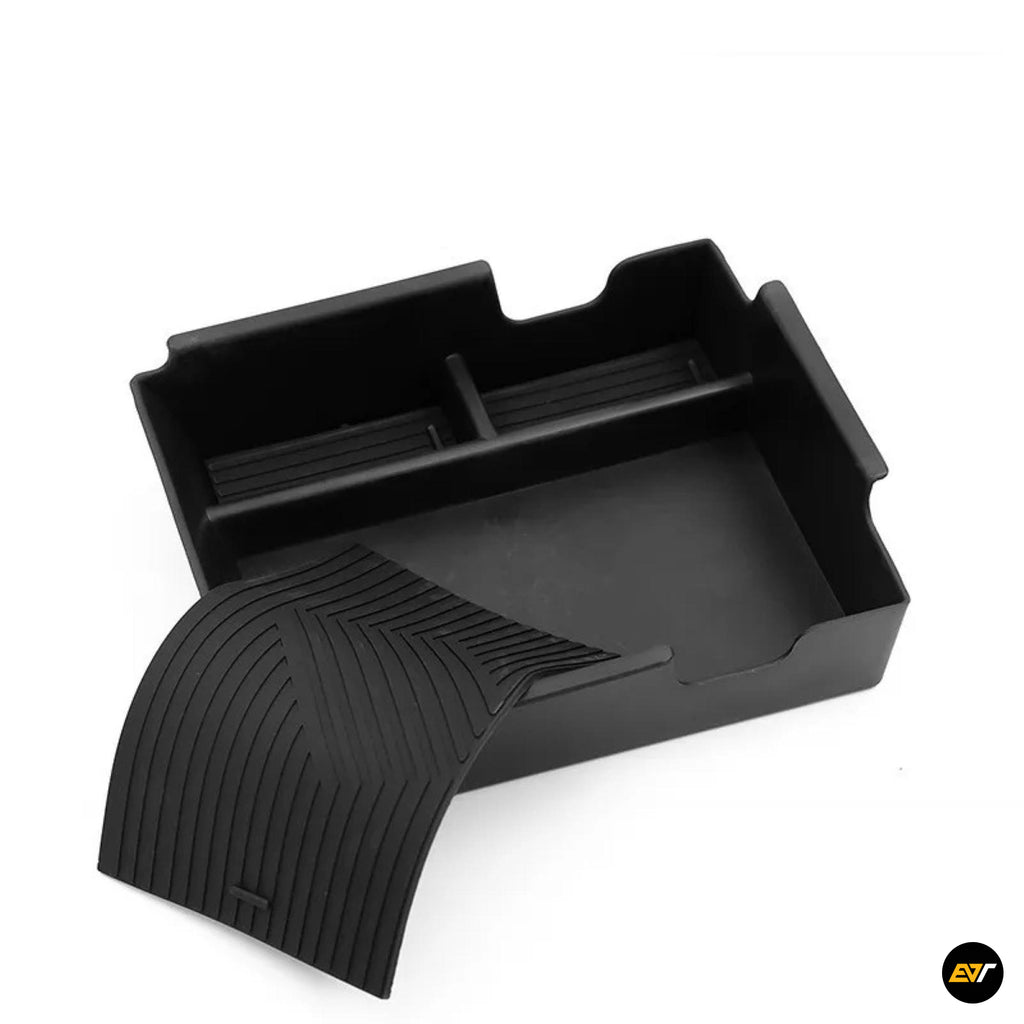 Black moulded vehicle storage tray with raised sides and a ribbed textured base section