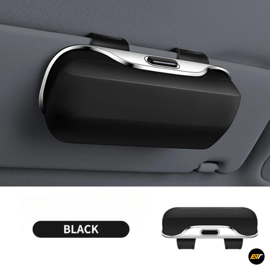 Black car sun visor storage holder with silver trim, shown attached to a grey vehicle sun visor