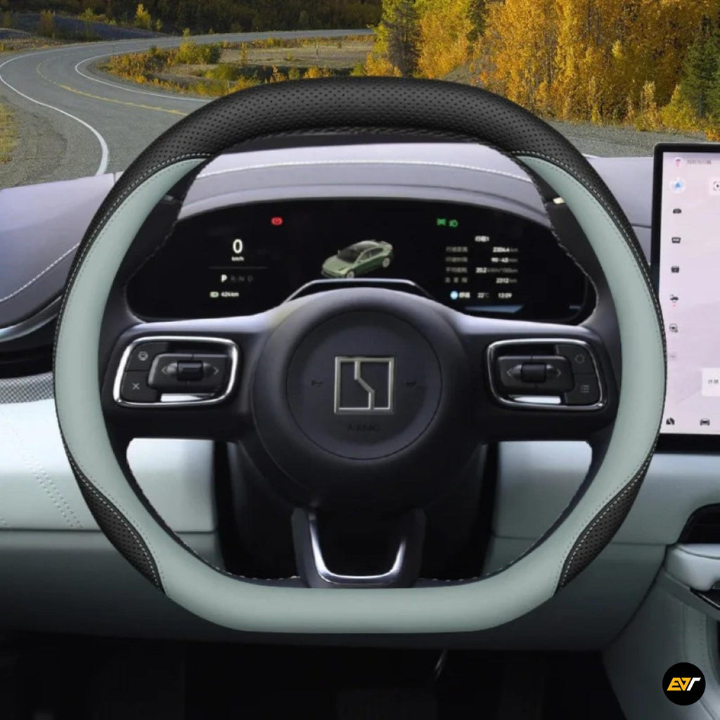Premium leather steering wheel cover installed on electric vehicle steering wheel with digital dashboard display in background