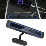 A Quick Charge USB Docking Station with a blue light and a phone next to it.
