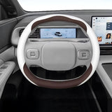 XPENG G6 Anti Slip Leather Steering Wheel Covers in brown and white Nappa leather fitted on electric vehicle steering wheel.
