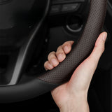 BYD Dolphin Steering Wheel Cover in black perforated PU leather showing enhanced grip on steering wheel.