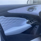 BYD Seal Armrest Window Riser Cover installed on RHD door panel with carbon fibre finish and premium materials.