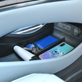 BYD Seal Centre Console Lower Storage Box organising essentials like keys, phone, and umbrella in vehicle compartment.