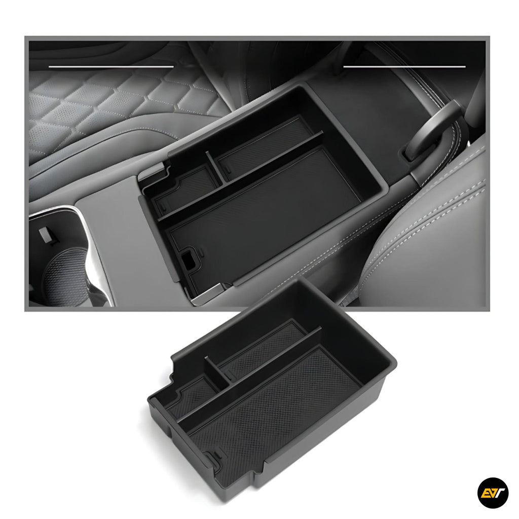 Black centre console organiser tray with multiple compartments for vehicle storage accessories inside car armrest compartment