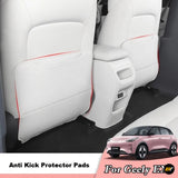 White anti kick protector pads fitted to rear seat backs in a Geely electric vehicle interior