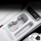 Vehicle centre console cup holder insert with two drink holders and a long storage compartment in a light grey finish