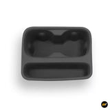 Black centre console storage tray with two cup holder recesses and a long lower compartment for organised vehicle storage