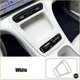 White centre console storage area trim panel displayed in an electric vehicle interior