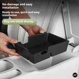 Black centre console storage tray being fitted inside a vehicle for convenient, organised storage and easy installation