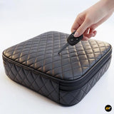 Black quilted zip storage case with a vehicle key fob, showcasing a protective holder for car keys