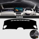 Black suede dashboard cover shown fitted inside an electric vehicle with steering wheel and central touchscreen display
