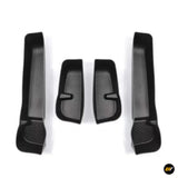 Four black textured moulded vehicle interior liners, including two long and two short pieces for organised storage areas