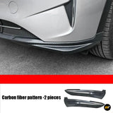 Carbon fibre pattern side skirt trim fitted to a silver car, with two matching pieces shown below