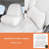White two piece car seat headrest and lumbar support cushions shown fitted to light interior seats