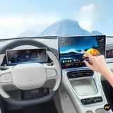 Electric vehicle interior with digital instrument display and large touchscreen infotainment system showing navigation and media controls