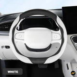White and black steering wheel cover fitted to a modern car interior with matching white dashboard trim