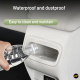 Water being poured into a waterproof dustproof car seat storage pocket for easy cleaning and maintenance