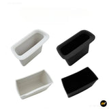 Four black and white rectangular plastic storage trays with rounded edges for vehicle interior organisation