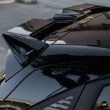 Glossy black vehicle roof spoiler with angular aerodynamic styling and reflective finish on a polished car roof