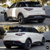 White Sealion SUV shown from two rear three quarter angles with a black roof rear spoiler and distinctive tail lights