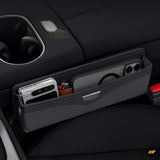 Black vehicle seat storage organiser with smartphone and small bottle in multiple compartments