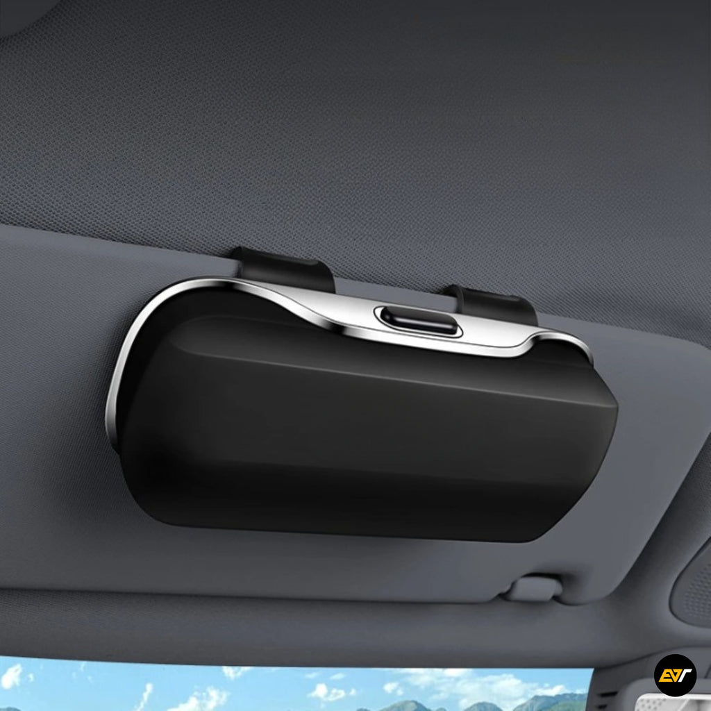 Black car sun visor accessory with a sleek storage compartment and USB C style port mounted inside a vehicle interior