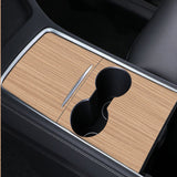 A wooden cup holder in a Tesla 3/Y, adding elegance and serving as a safeguard, along with Tesla Central Control Panel Protective Stickers in the car.