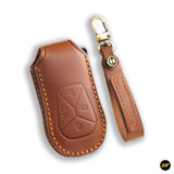 Brown leather protective key fob cover with stitching and detachable wrist strap with metal clasp and logo emblem