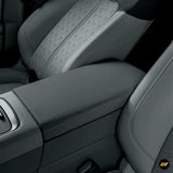 Luxurious grey protective cover fitting the centre armrest box in a modern electric vehicle interior