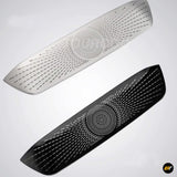 Two elongated car centre console air vent covers in black and silver with perforated radial design patterns