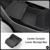 Black centre console lower storage box with textured lid for vehicle interior organisation and convenience.