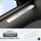 Silver titanium door air vent protection cover installed on car door interior panel with stitching detail