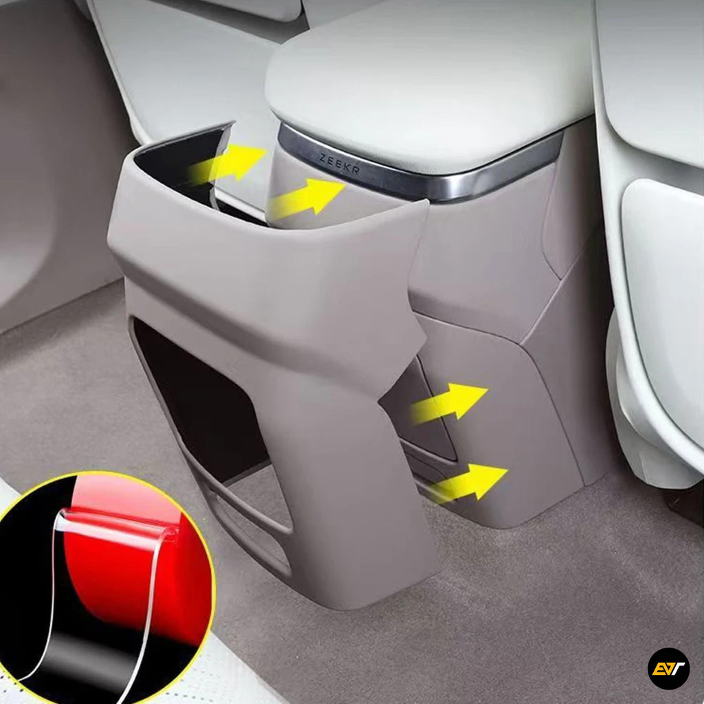 Close-up of grey rear centre console cover with air outlet frame for electric vehicle interior detailing