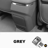 Grey rear centre console panel cover for car interior, designed to fit around seats with smooth finish and precise cutouts