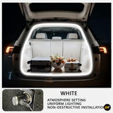 Open car trunk illuminated by white LED light strips, highlighting luggage and flower arrangement inside a Zeekr vehicle.