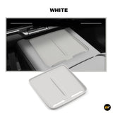 White wireless charging anti-slip silicone pad placed on a car centre console for electric vehicle accessories
